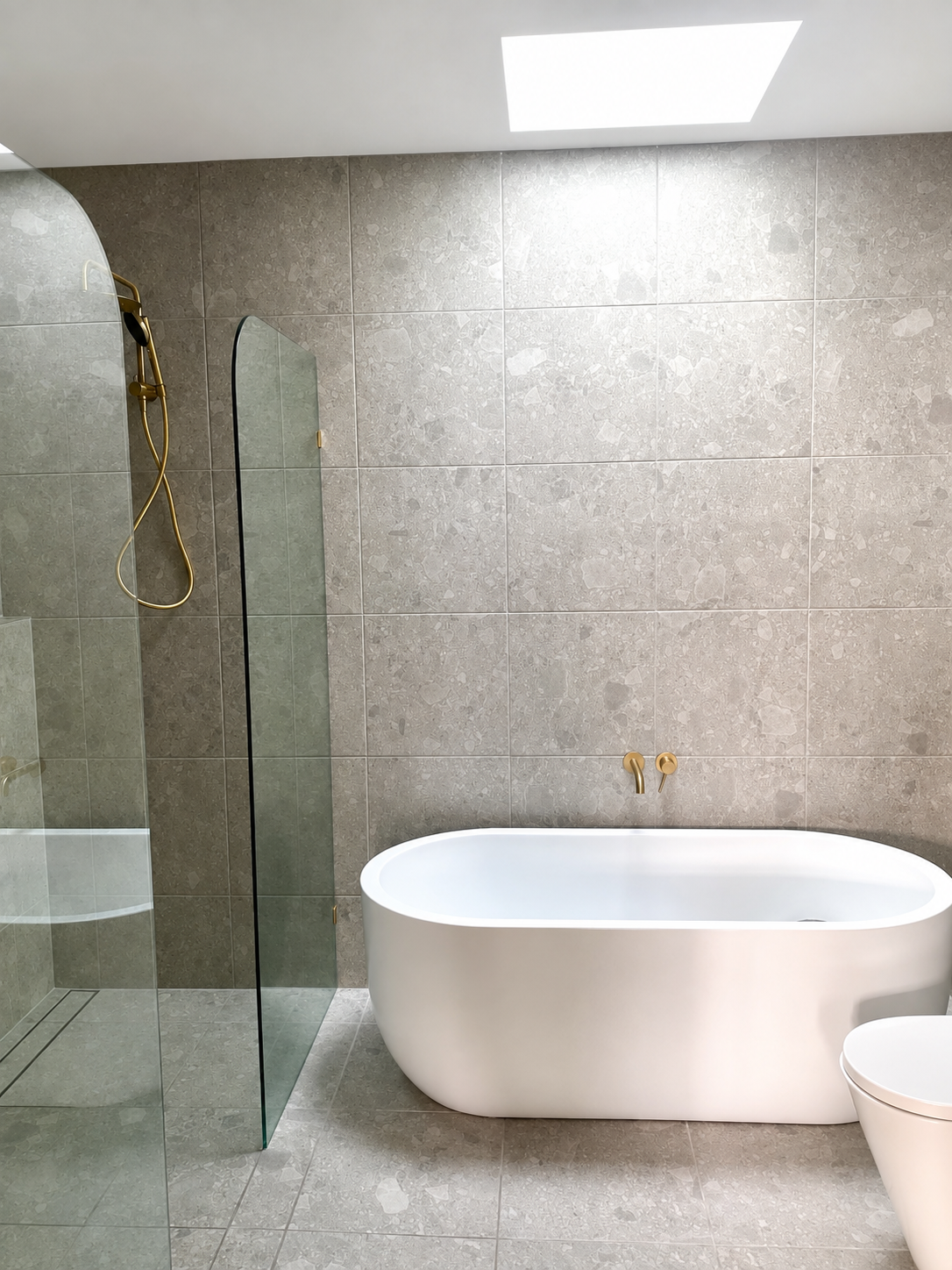 Finished bathroom renovation with freestanding bath.